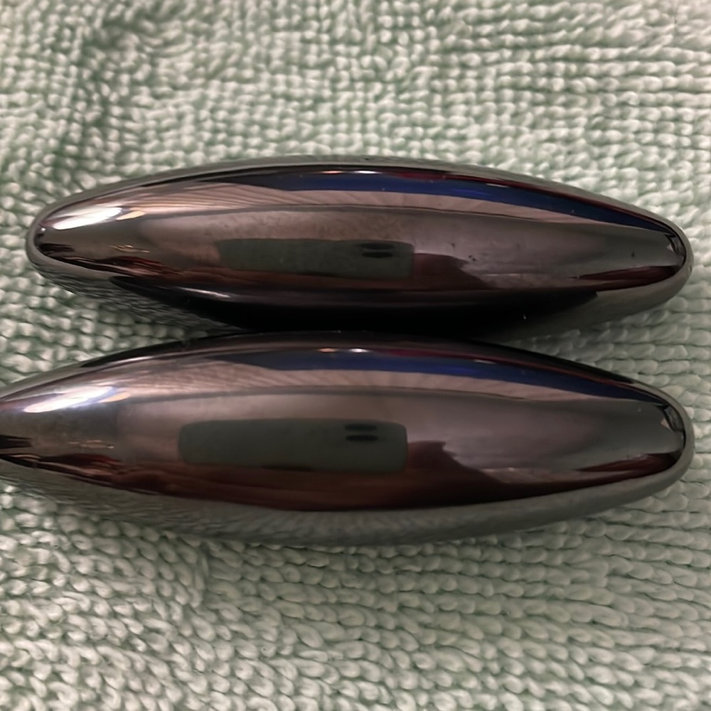 Magnetic long slender to a point objects. Measuring  2 1/4 inches long 1/4 in w.